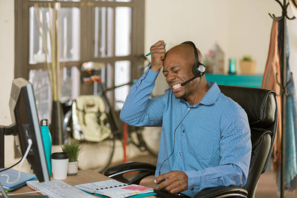 Stressed professional man working on a call