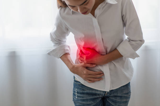 Unhealthy asian woman hands touching her belly, Looking like stomach pain, Healthcare concept