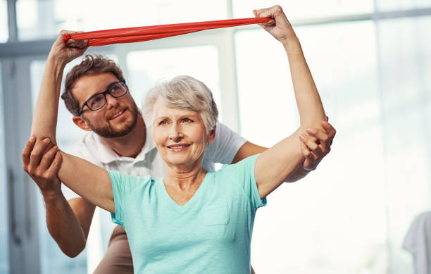 Cropped shot of a senior woman working through her recovery with a male physiotherapist