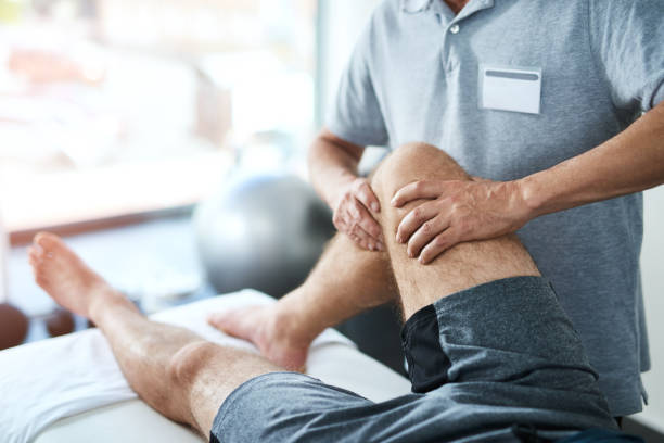 Cropped shot of an unrecognizable male physiotherapist treating a patient